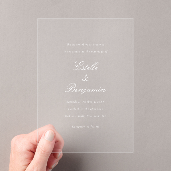 acrylic wedding invitation in hand